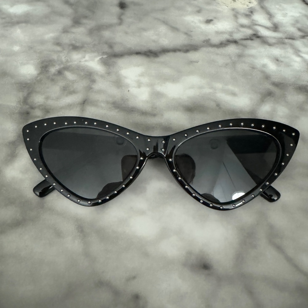 Cute trendy cat-eye sunglasses, with studs around the frames.